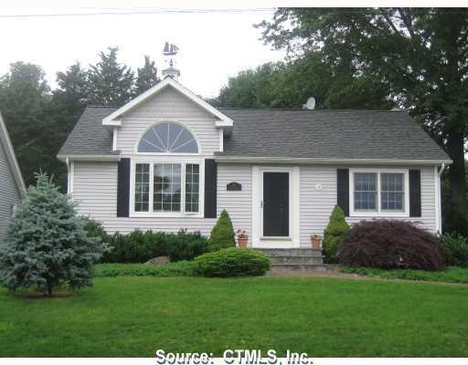 13 Merrill Road Clinton, CT 06413 - Photo 1 of 1 a front view of a house with a yard and porch