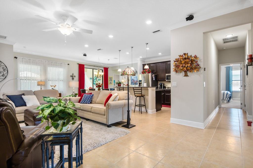 15437 Mulholland Road Parrish, FL 34219 - Photo 11 of 47 Entering the 14'x 26' Great Room with a view of the Kitchen and Eat-In Area in the Kitchen