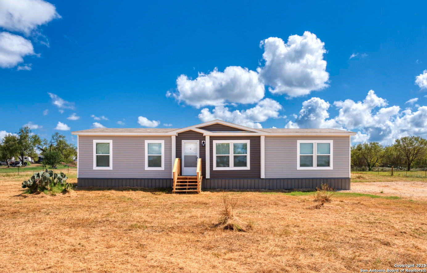 0 County Road 065 Jasper, TX 75951 - Photo 3 of 13 a front view of a house with a yard
