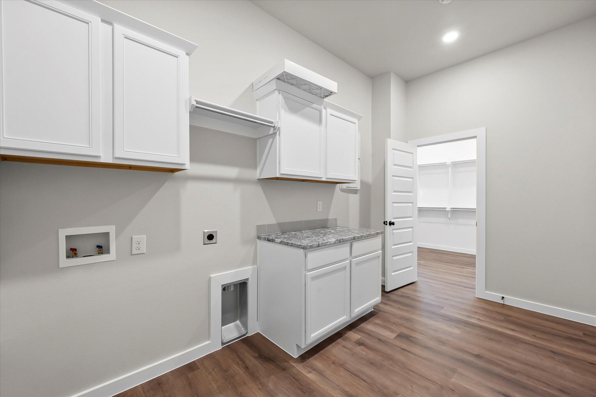 7436 30th Street Lubbock, TX 79407 - Photo 24 of 25 a kitchen with stainless steel appliances granite countertop a stove and a refrigerator