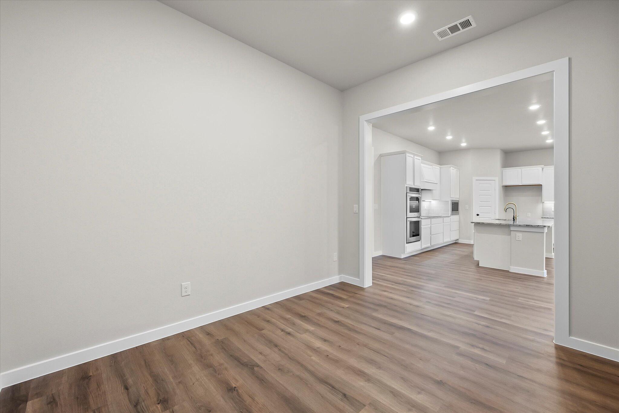 7436 30th Street Lubbock, TX 79407 - Photo 8 of 25 a view of kitchen with wooden floor