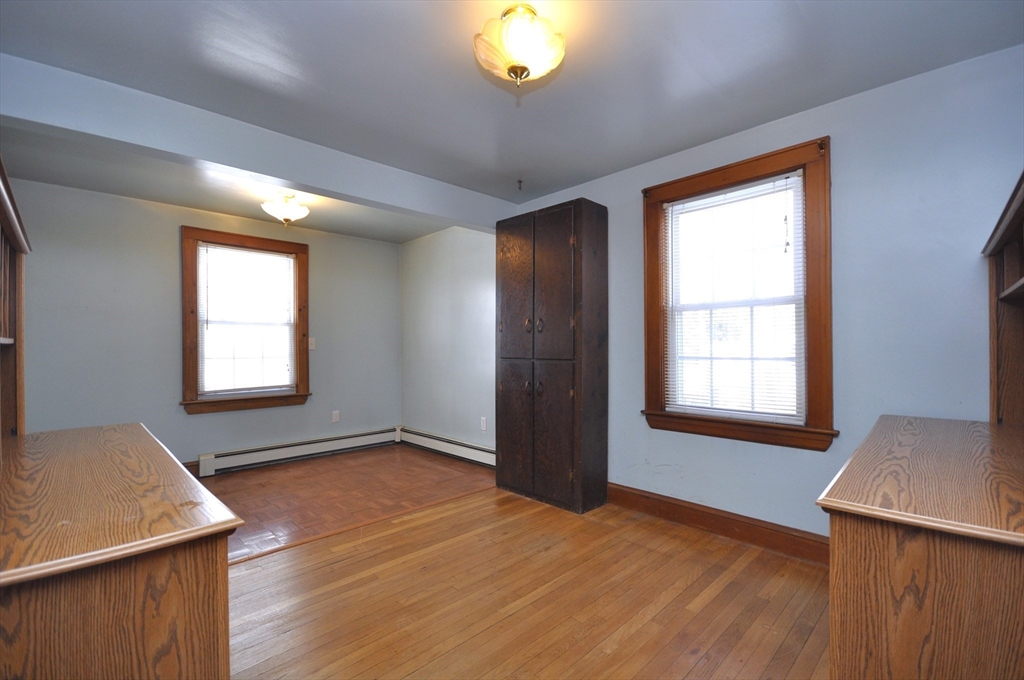 34 Guild Road Brockton, MA 02302 - Photo 12 of 22 a view of an empty room with a window and wooden floor