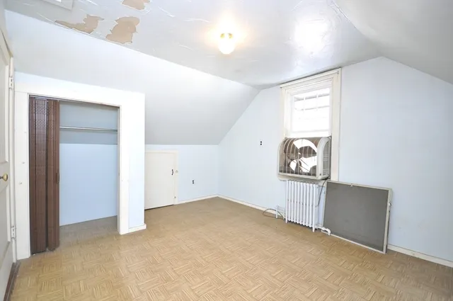 a bathroom with a sink a toilet and a shower curtain