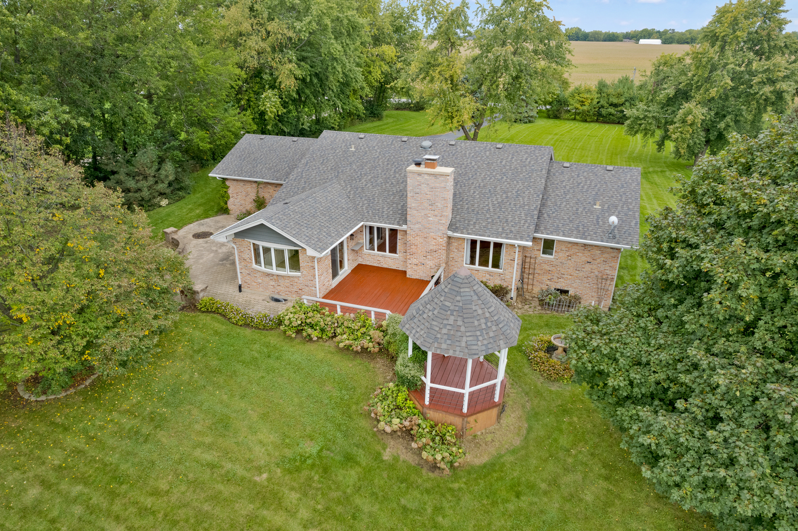 12929 Smith Road Manhattan, IL 60442 - Photo 2 of 41 an aerial view of a house with a garden