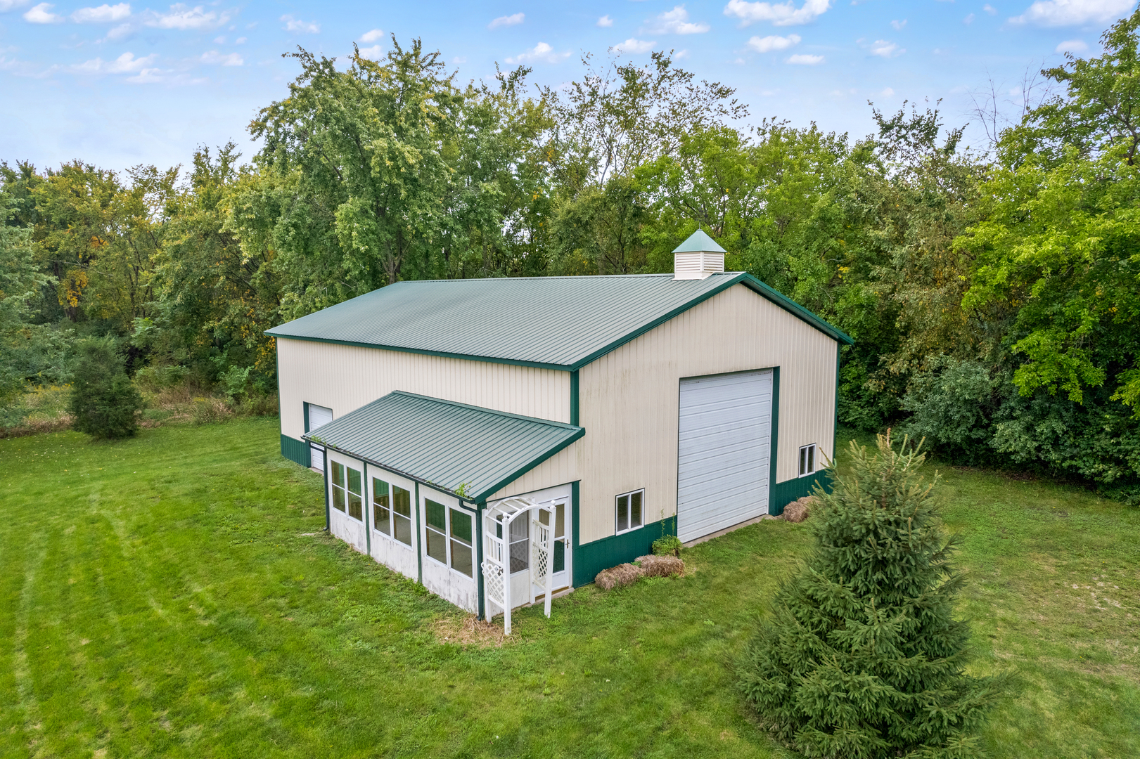 12929 Smith Road Manhattan, IL 60442 - Photo 3 of 41 a aerial view of a house with yard and trees in the background