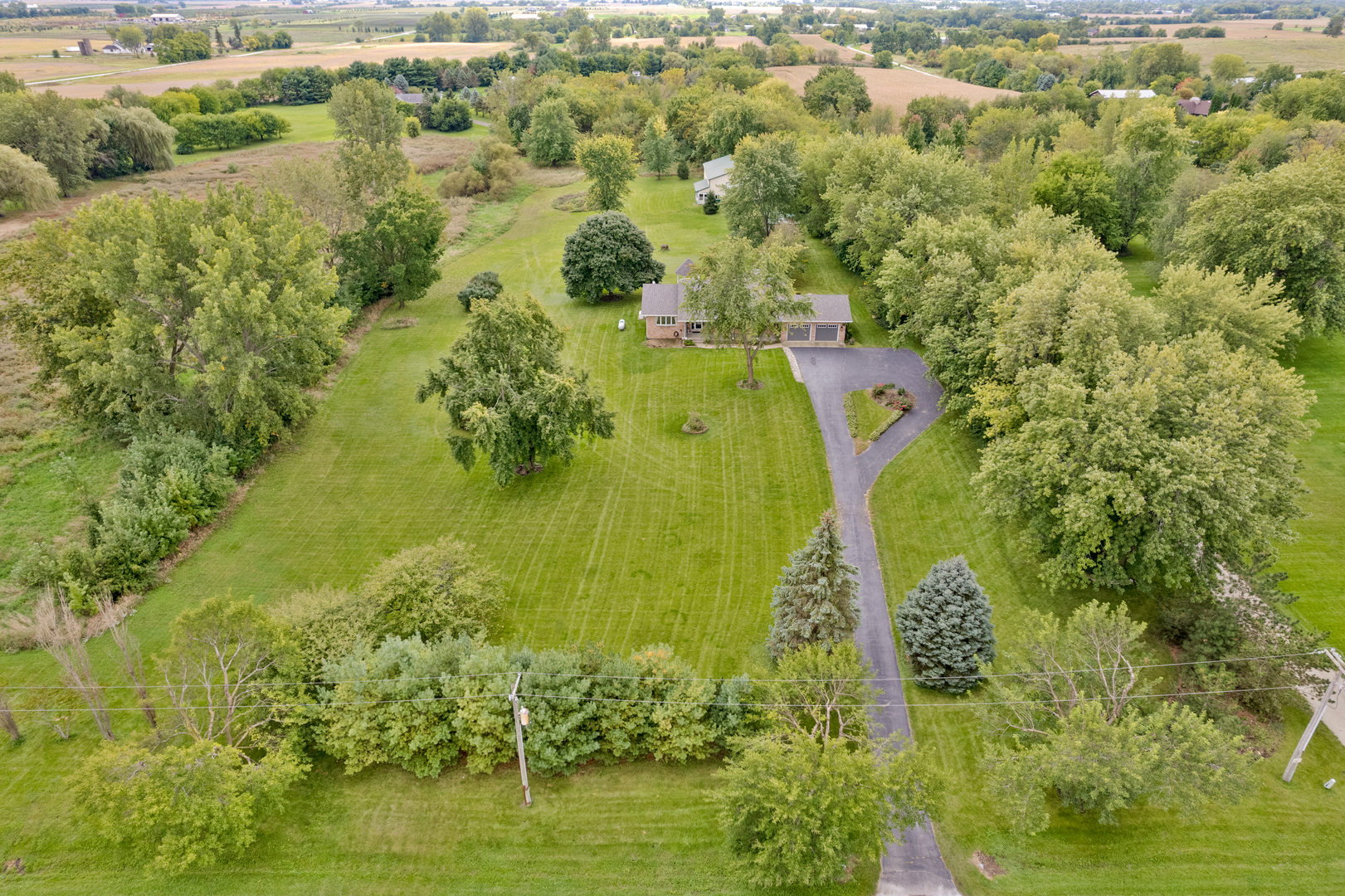 12929 Smith Road Manhattan, IL 60442 - Photo 4 of 41 a aerial view of a residential houses with yard