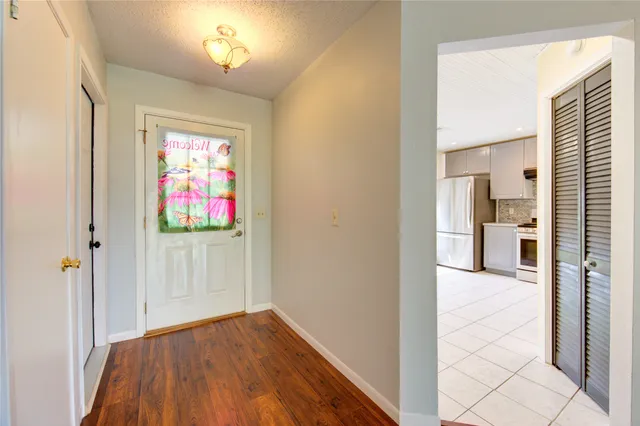 a kitchen with stainless steel appliances a refrigerator and a stove top oven