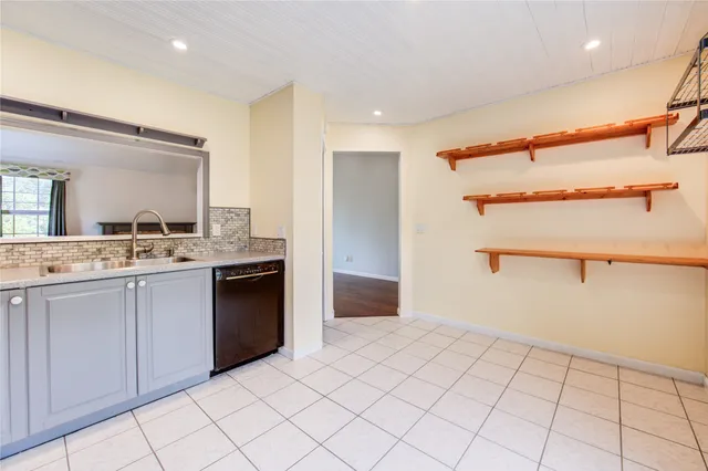 a kitchen with a stove sink and refrigerator