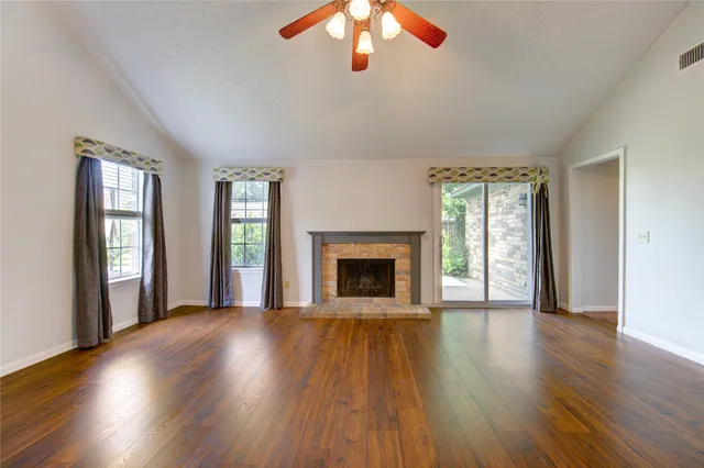 a view of a livingroom with wooden floor
