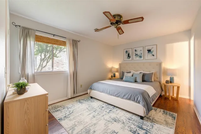 a view of an empty room and wooden floor