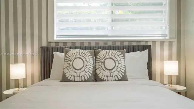 a living room with furniture and a lamp