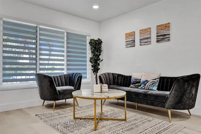 a backyard of a house with yard fire pit and outdoor seating