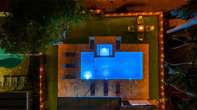 a view of a patio with couches and a table and chairs with garden view