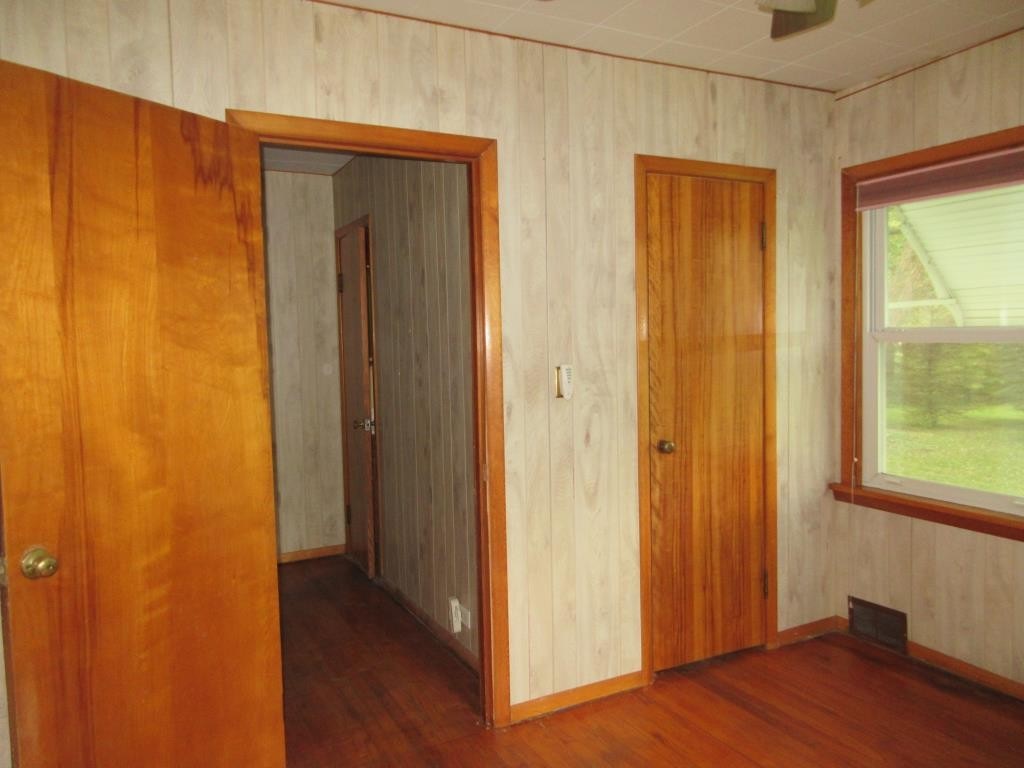 303 Marengo Road Harvard, IL 60033 - Photo 8 of 13 a view of a hallway with wooden floor