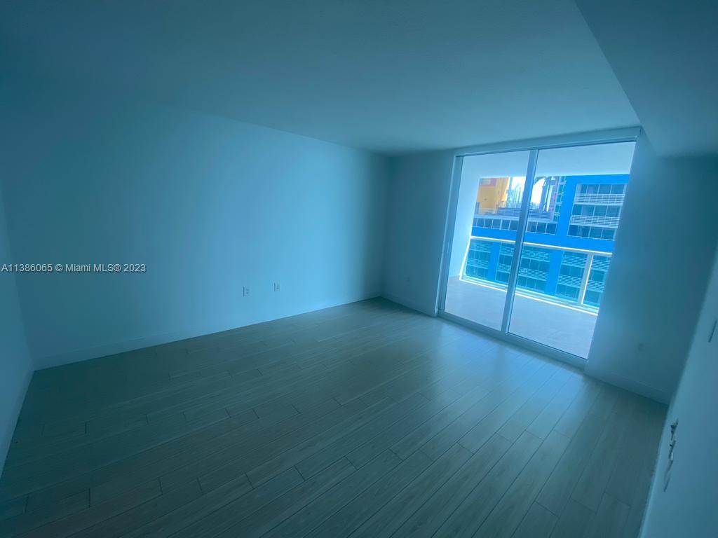 2101 Brickell Avenue, Unit 704 Miami, FL 33129 - Photo 7 of 32 an empty room with windows