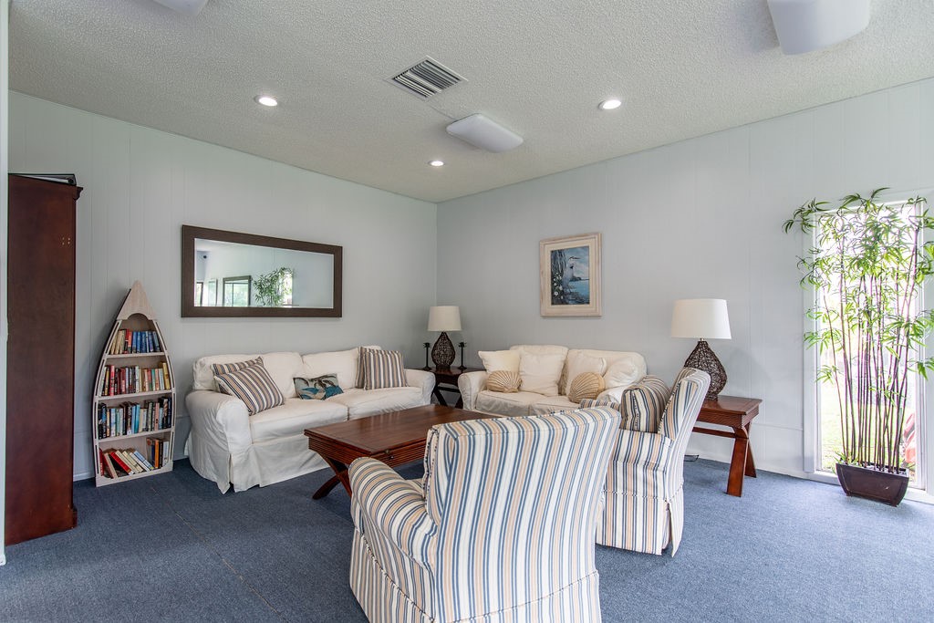 1815 Robalo Drive, Unit C201 Vero Beach, FL 32960 - Photo 27 of 31 a living room with furniture and a window