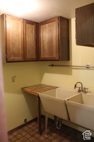 4709 East Independence Road Myton, UT 84052 - Photo 23 of 27 Washroom featuring baseboards and cabinet space
