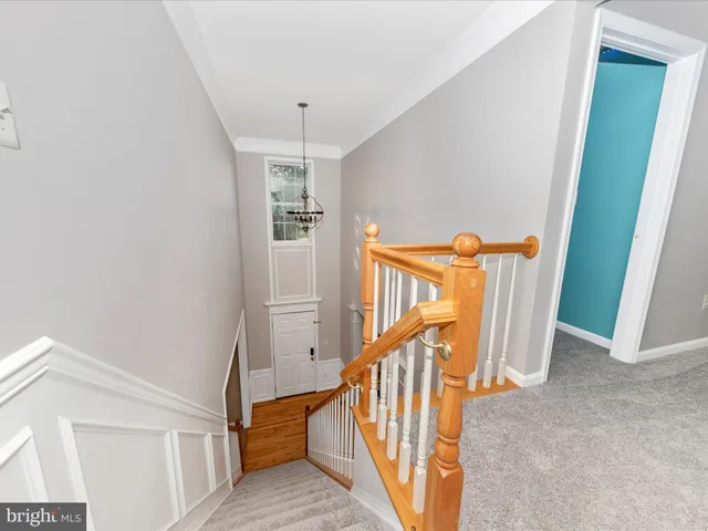 a view of a hallway with stairs