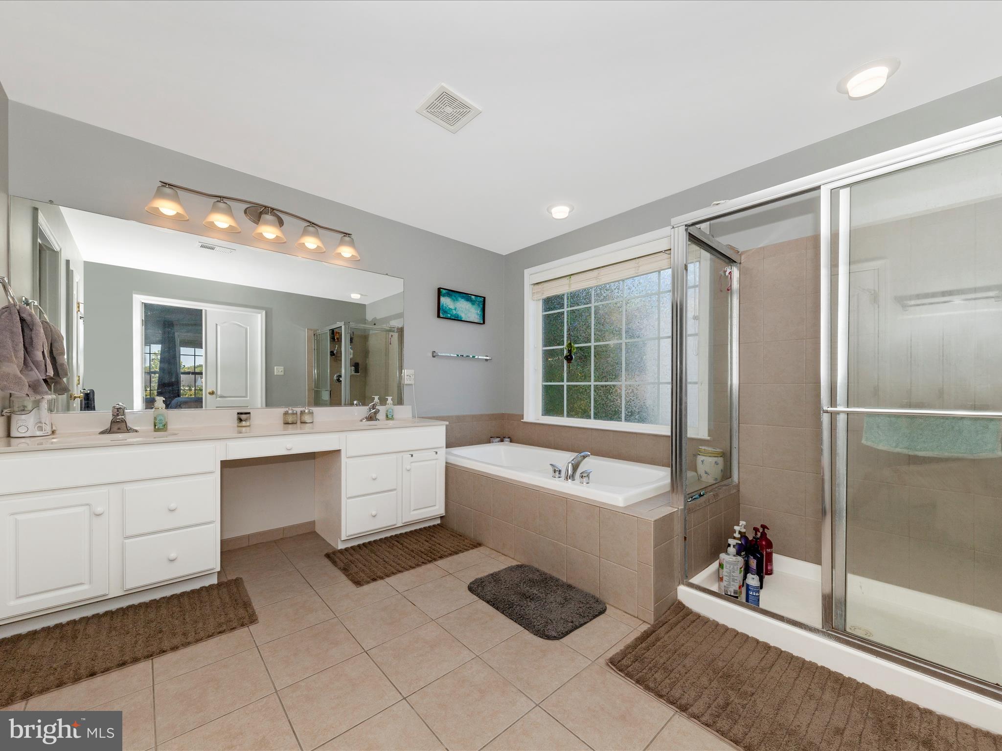 4 Jeffrey Lane Brunswick, MD 21758 - Photo 23 of 39 a bathroom with a tub sink shower and mirror