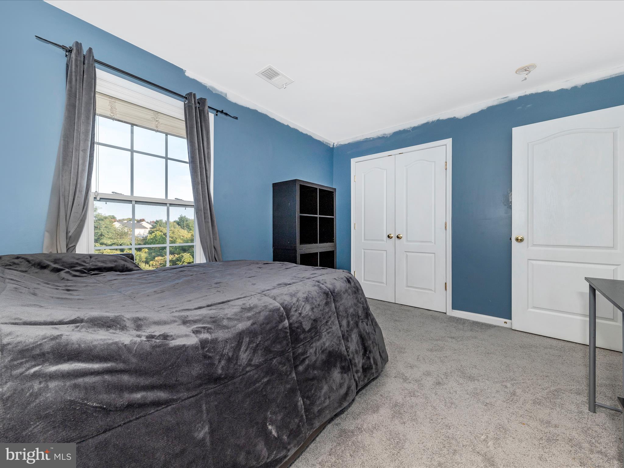 4 Jeffrey Lane Brunswick, MD 21758 - Photo 28 of 39 a bed sitting in a spacious bedroom next to a window