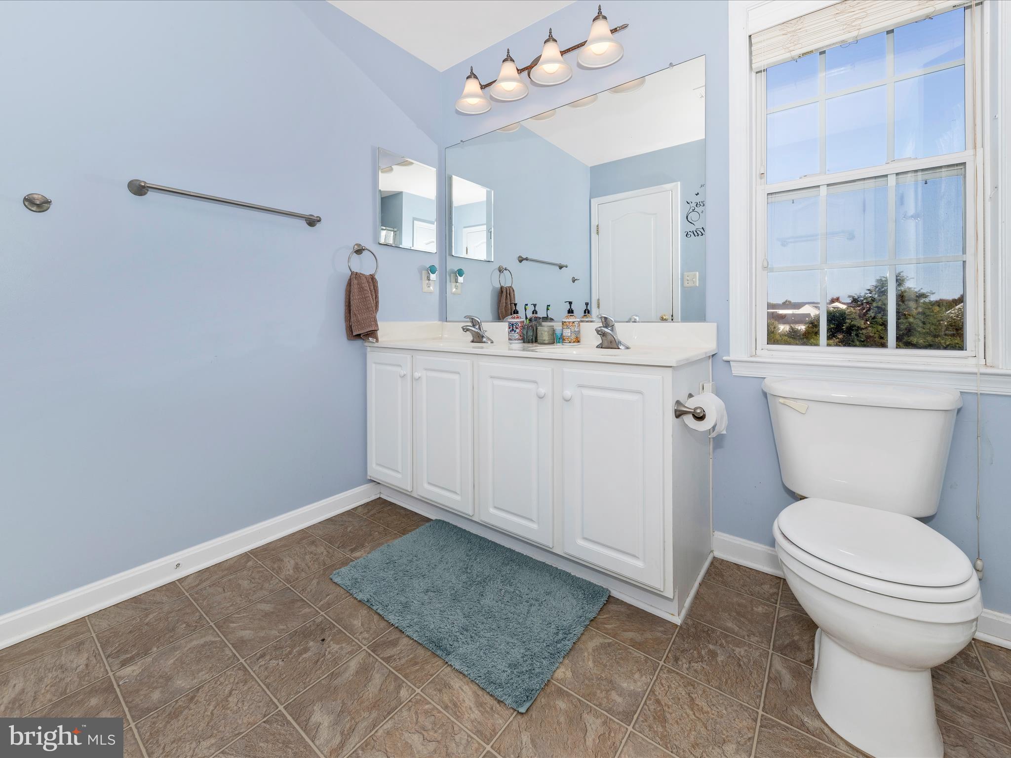 4 Jeffrey Lane Brunswick, MD 21758 - Photo 32 of 39 a bathroom with a sink a toilet and a mirror