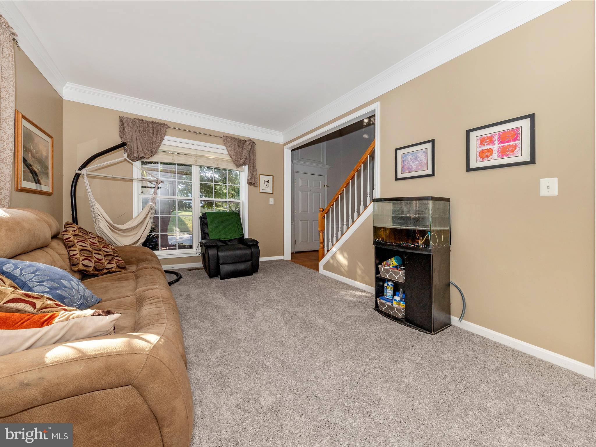 4 Jeffrey Lane Brunswick, MD 21758 - Photo 6 of 39 a living room with furniture a window and a fireplace