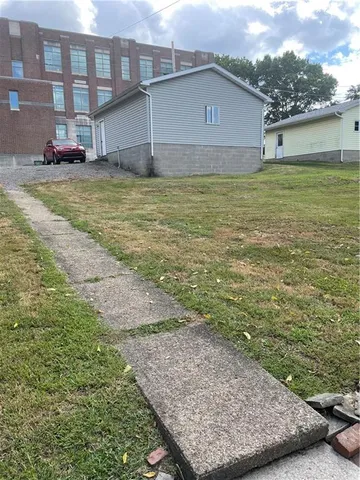a view of a water with lawn chairs
