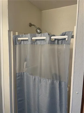 a utility room with dryer washer and a window