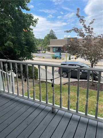 a view of a house with backyard and garden