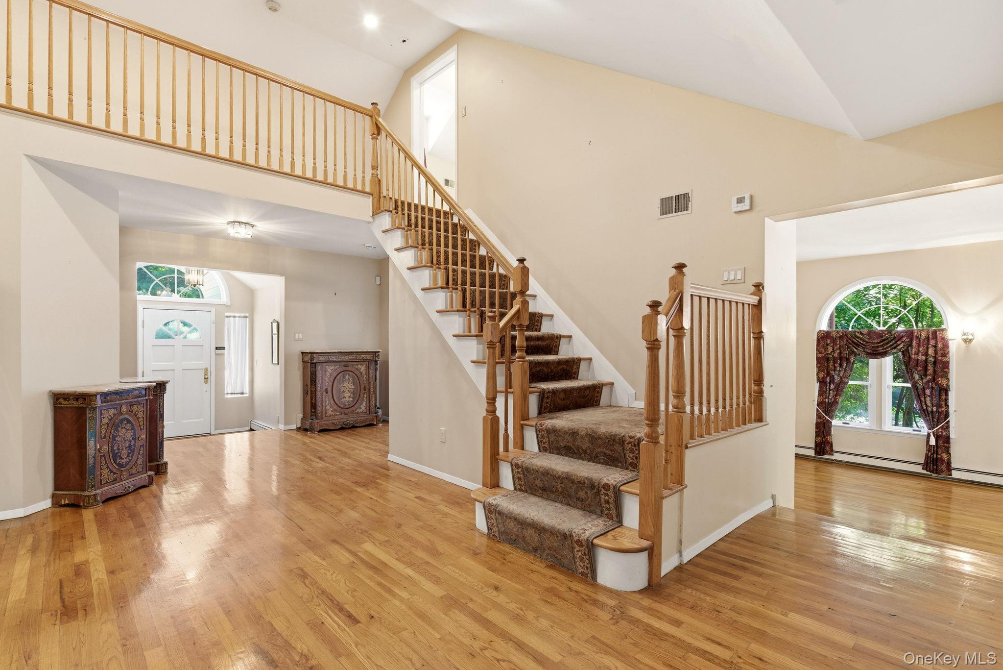 380 Duck Pond Road Locust Valley, NY 11560 - Photo 9 of 41 Main staircase leading to 2nd floor
