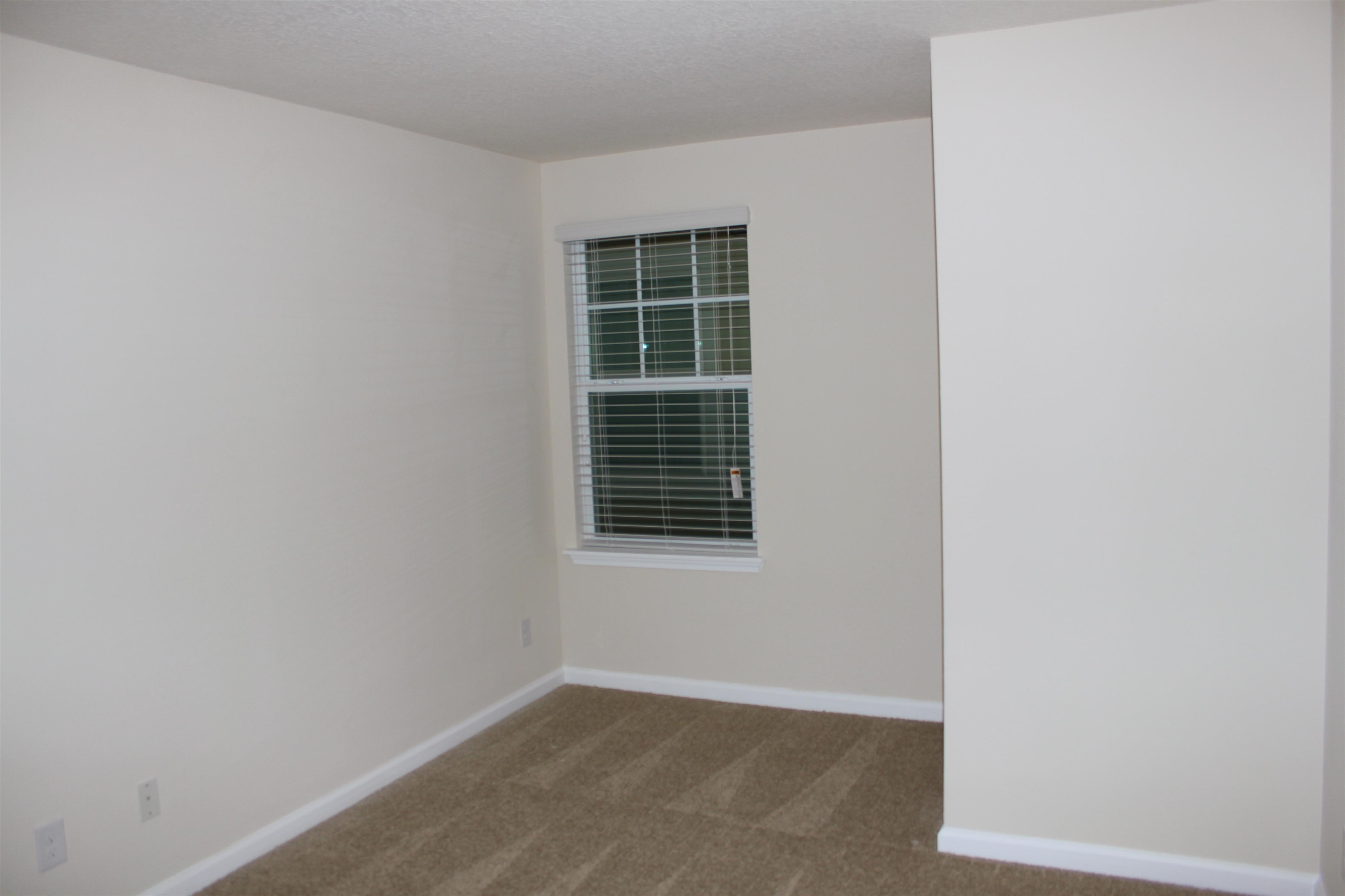 811 Golden Lake Loop St. Augustine, FL 32084 - Photo 13 of 20 a view of an empty room with a window