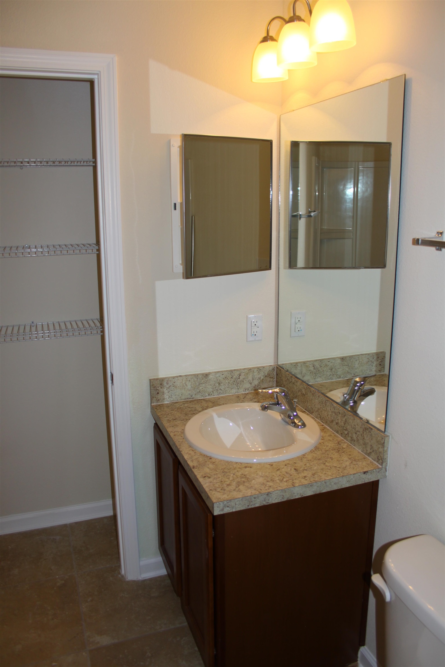 811 Golden Lake Loop St. Augustine, FL 32084 - Photo 14 of 20 a bathroom with a granite countertop sink and a mirror
