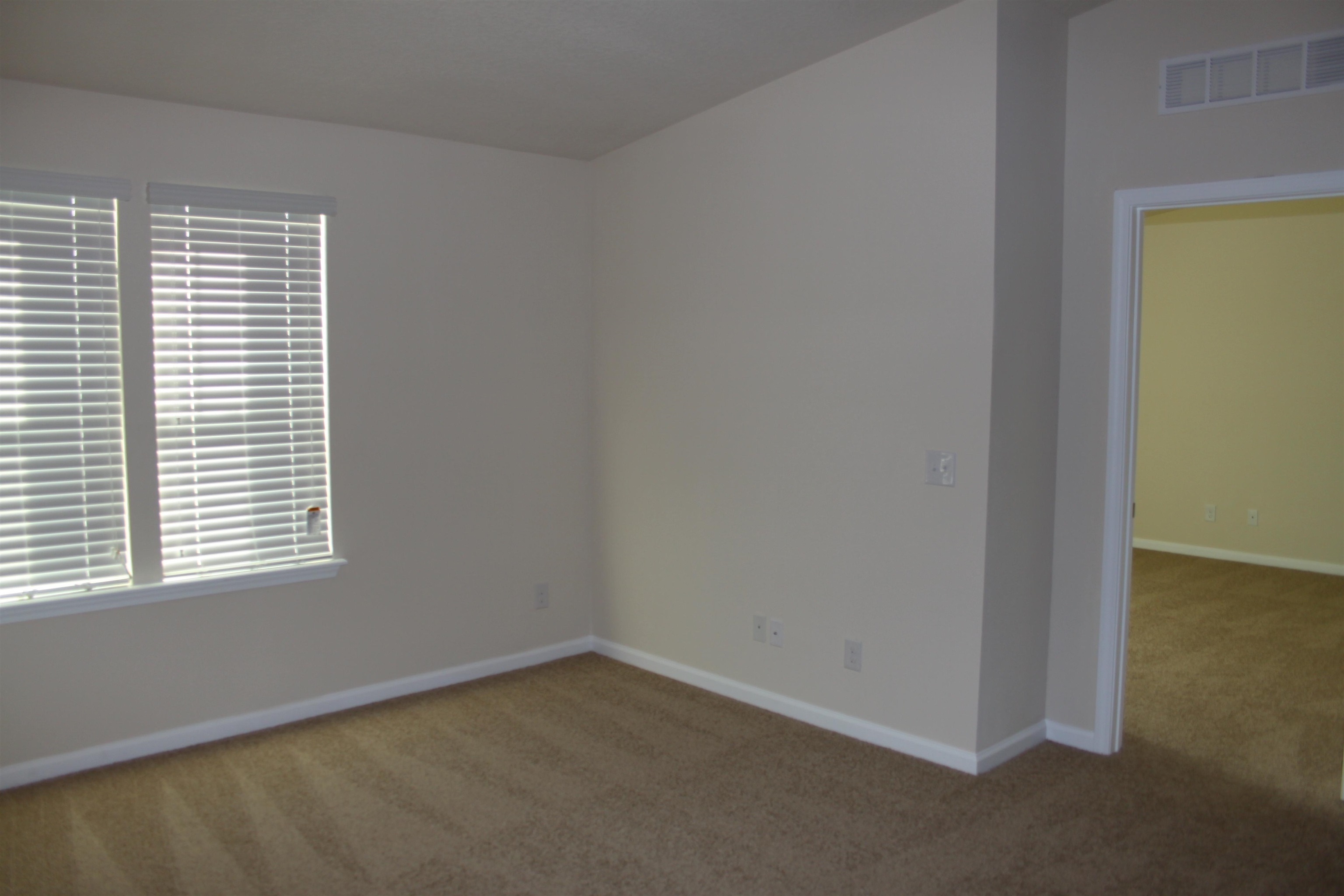 811 Golden Lake Loop St. Augustine, FL 32084 - Photo 9 of 20 an empty room with a window