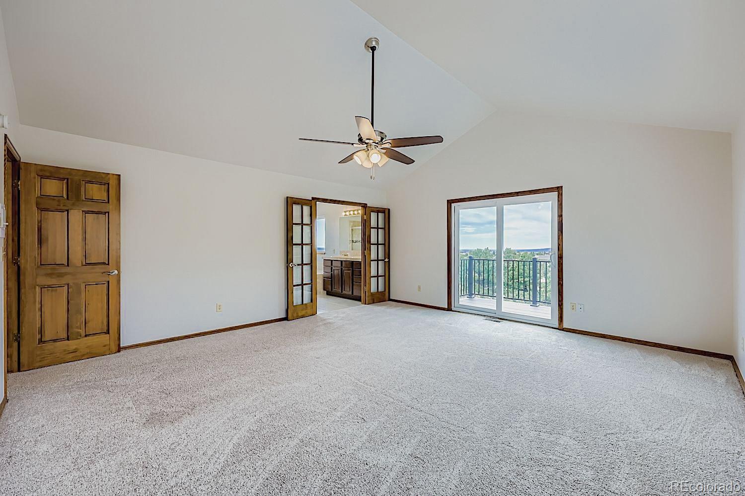 5825 Wilson Road Colorado Springs, CO 80919 - Photo 20 of 50 a view of an empty room with a window