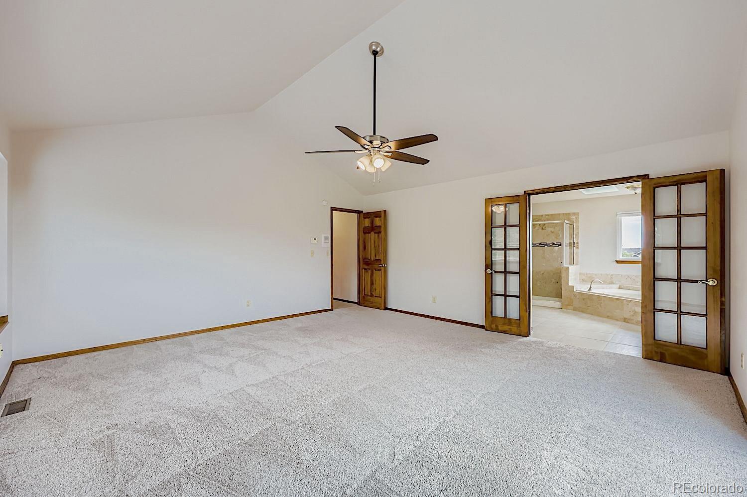 5825 Wilson Road Colorado Springs, CO 80919 - Photo 21 of 50 a view of an empty room with a ceiling fan