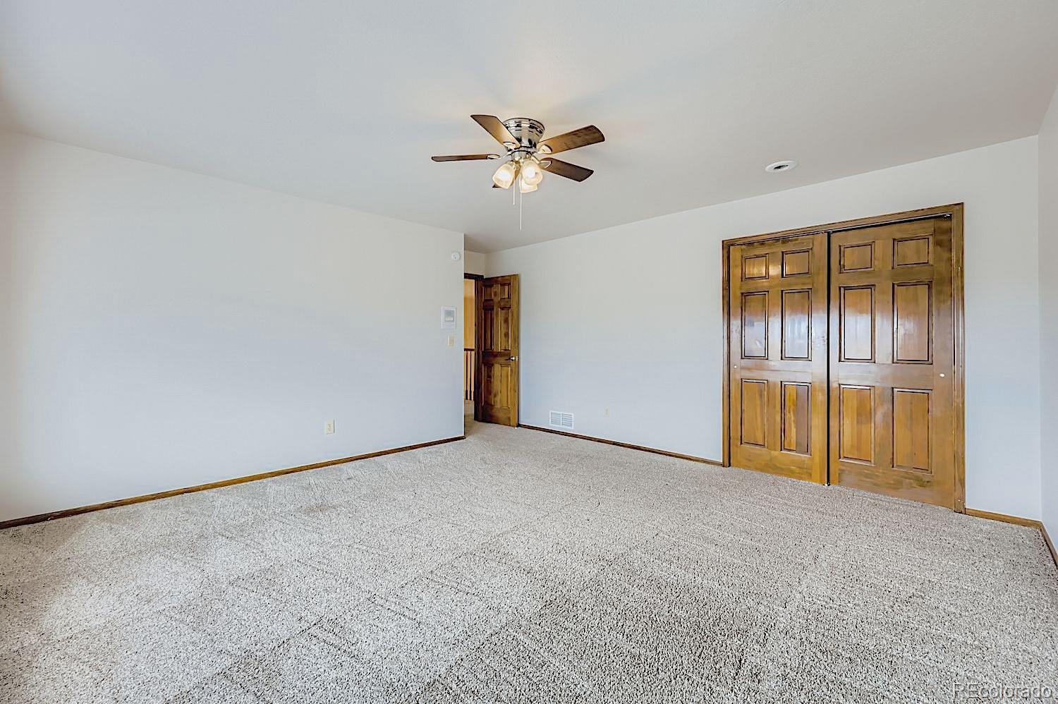5825 Wilson Road Colorado Springs, CO 80919 - Photo 29 of 50 a view of an empty room with a window