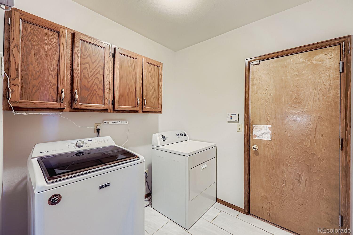 5825 Wilson Road Colorado Springs, CO 80919 - Photo 42 of 50 a utility room with dryer and washer
