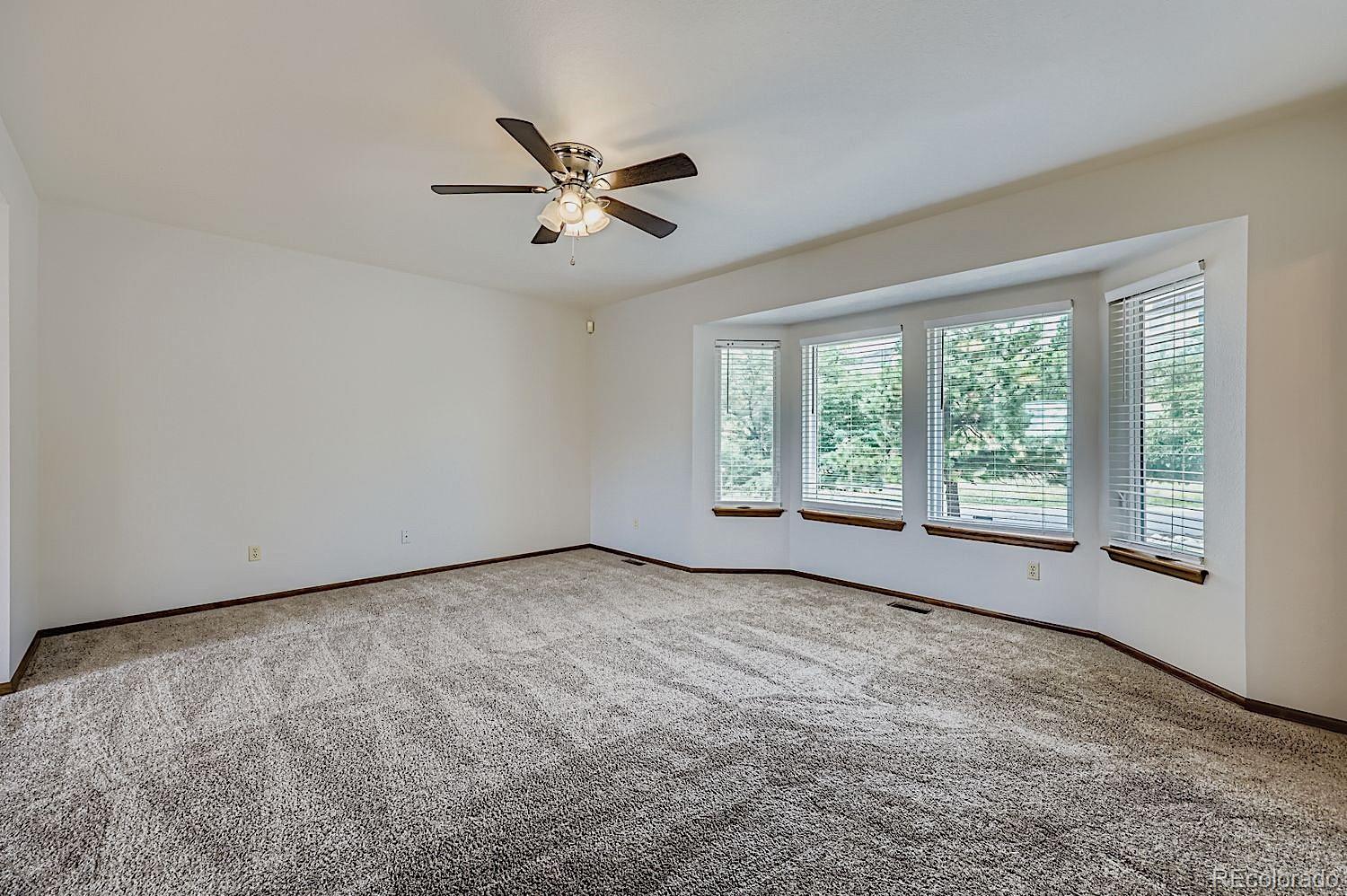 5825 Wilson Road Colorado Springs, CO 80919 - Photo 6 of 50 a view of an empty room with a window