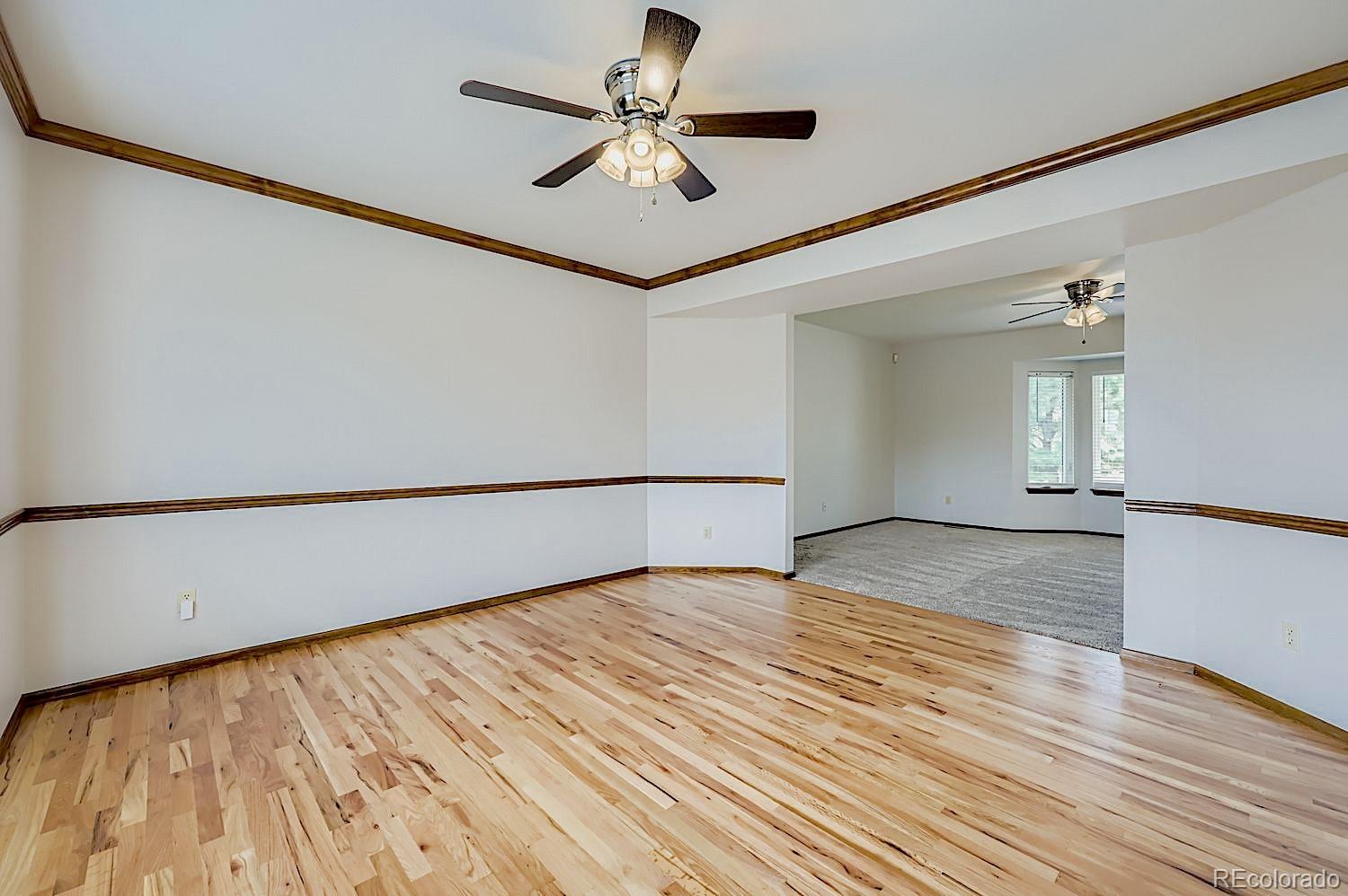5825 Wilson Road Colorado Springs, CO 80919 - Photo 9 of 50 a view of empty room with wooden floor
