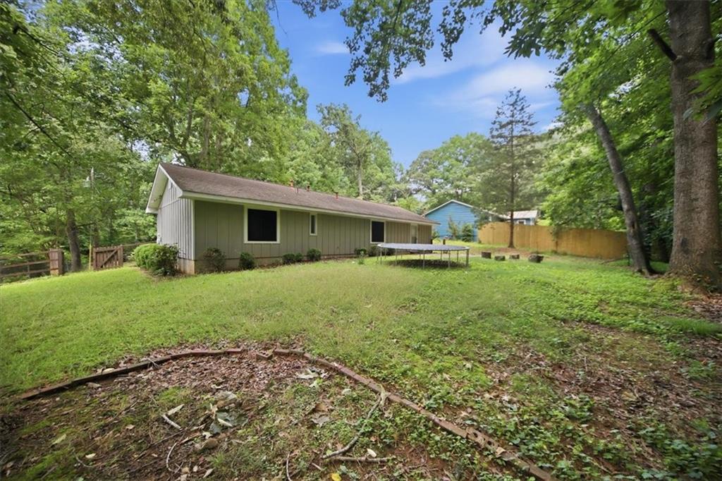 142 Deer Run Canton, GA 30114 - Photo 23 of 24 a front view of house with yard and green space