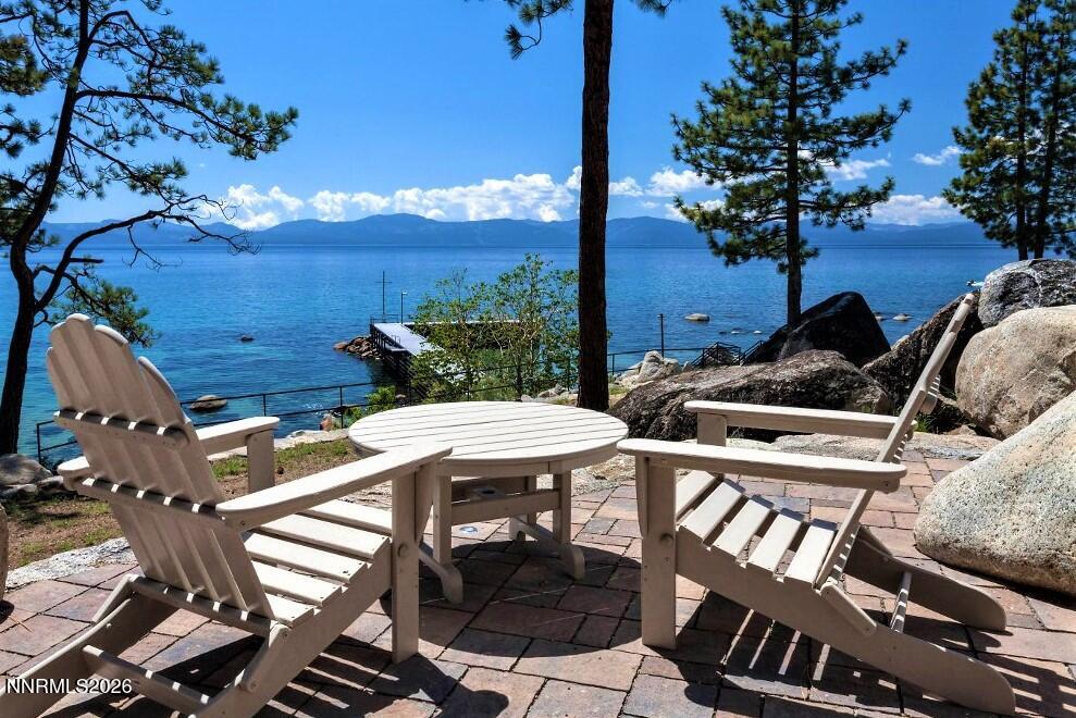 38 South Point Place Glenbrook, NV 89413 - Photo 21 of 24 a view of a patio with table and chairs with wooden floor and fence