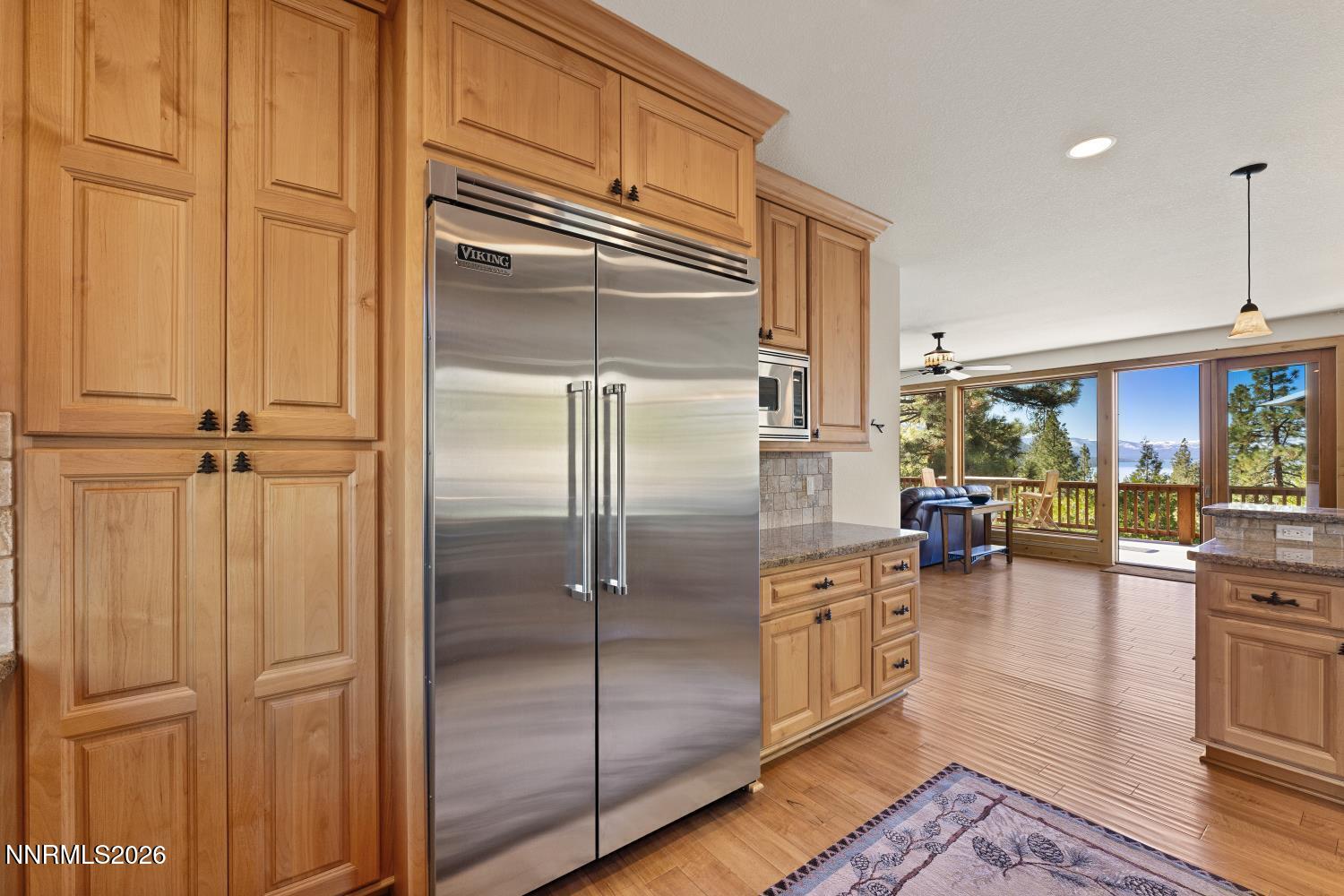 38 South Point Place Glenbrook, NV 89413 - Photo 9 of 24 a kitchen with stainless steel appliances granite countertop a refrigerator a stove and a sink with dishwasher