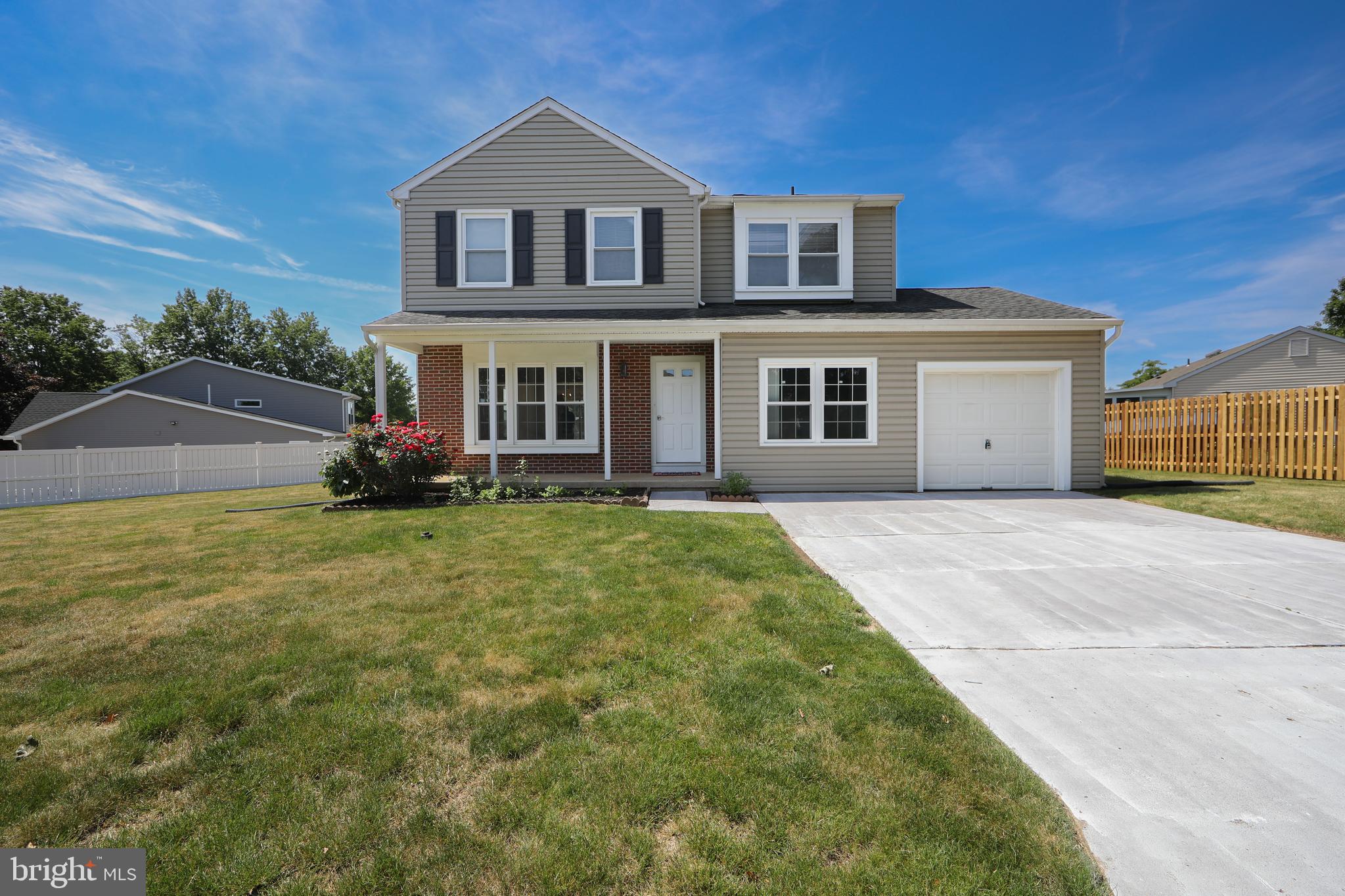 3007 Rampart Road Bensalem, PA 19020 - Photo 1 of 48 a front view of a house with a yard and garage