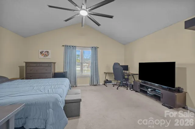 a spacious bathroom with a double vanity sink a mirror and shower