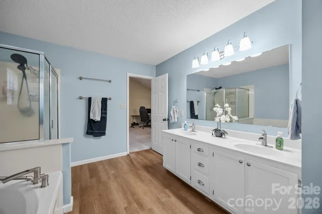 a bathroom with a bathtub and a shower