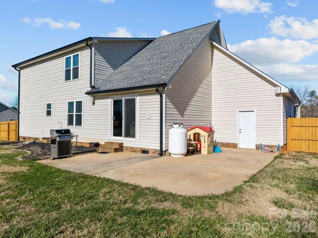 a park view with a fountain plants and big trees