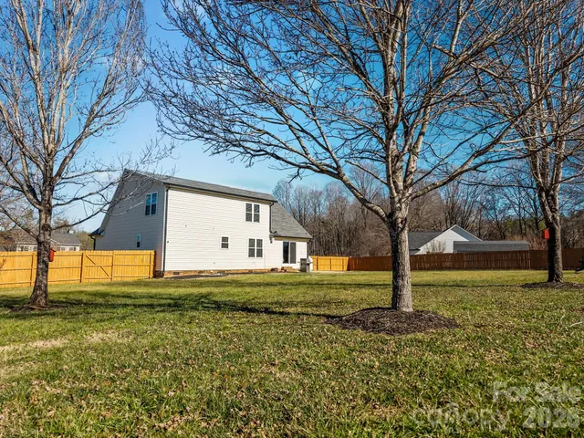 a swimming pool with an outdoor space and seating area