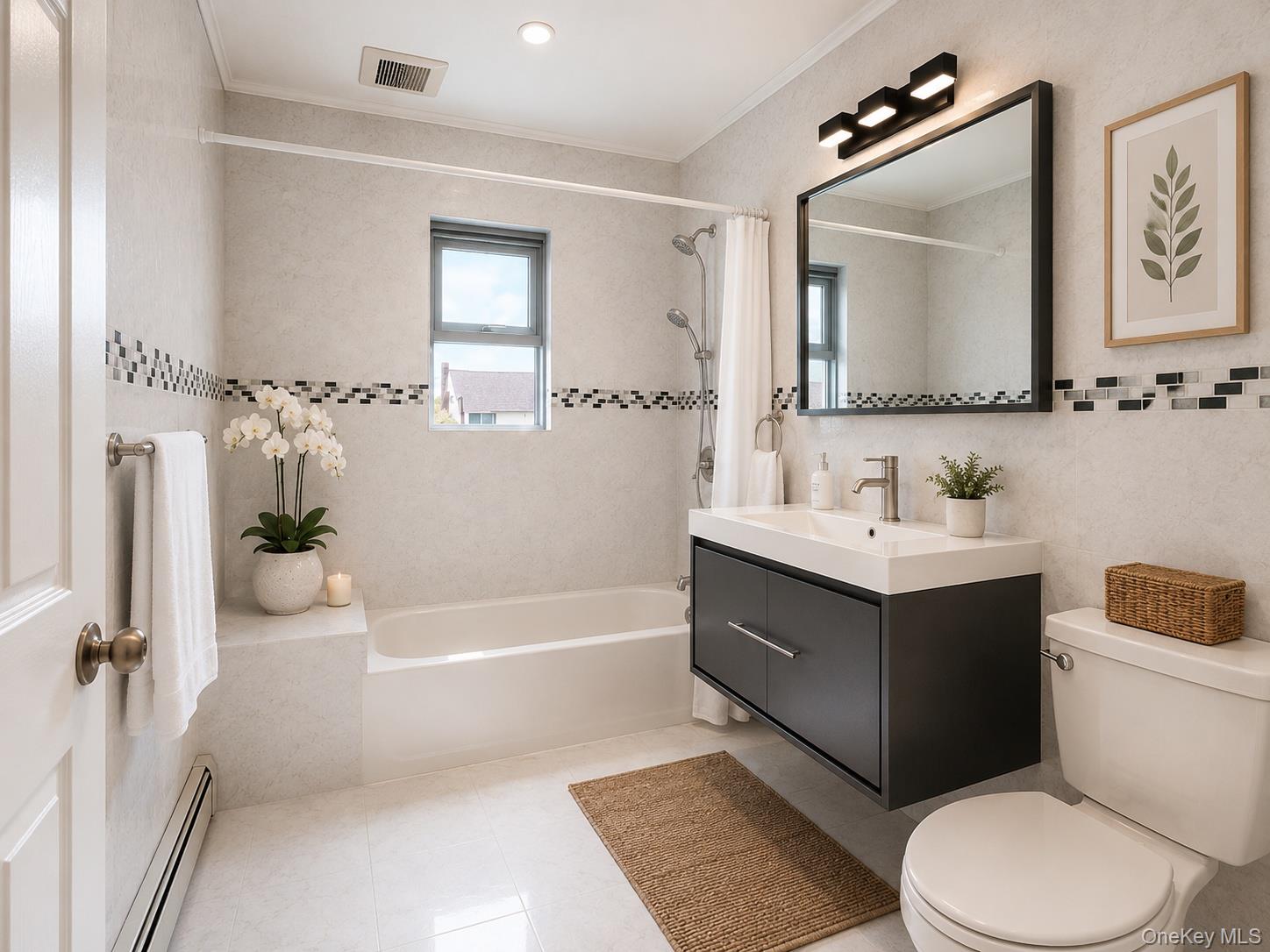 45-32 Westminster Road Great Neck, NY 11020 - Photo 14 of 21 a bathroom with a sink vanity mirror bathtub and toilet