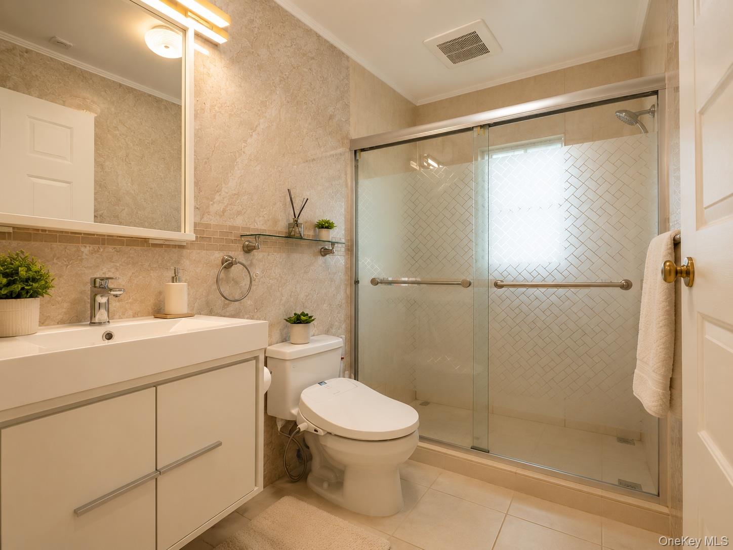 45-32 Westminster Road Great Neck, NY 11020 - Photo 18 of 21 a bathroom with a sink toilet and shower