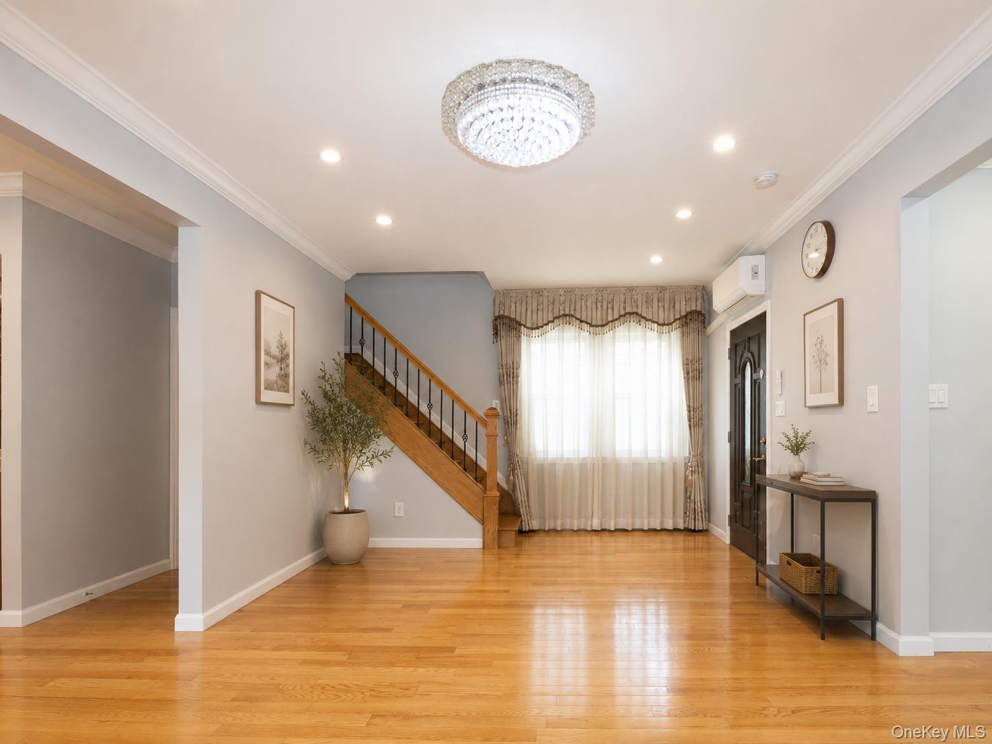 45-32 Westminster Road Great Neck, NY 11020 - Photo 4 of 21 a view of an entryway with wooden floor